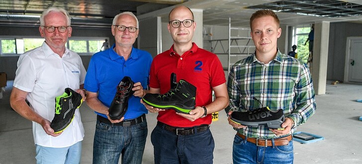 Arno Eschbach, Christian und Steffen Wighardt und der zukünftige Shopleiter Dennis Hiller